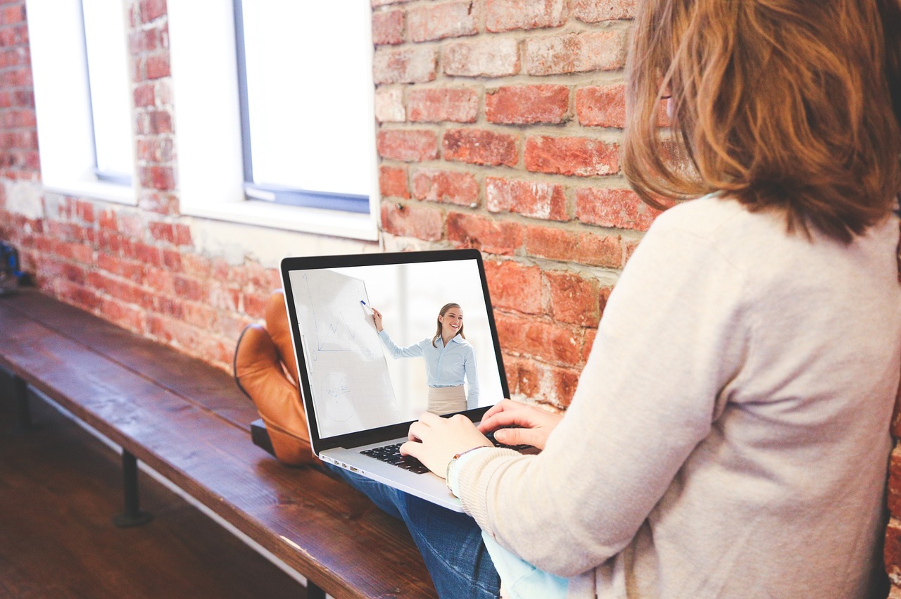 person learning online laptop