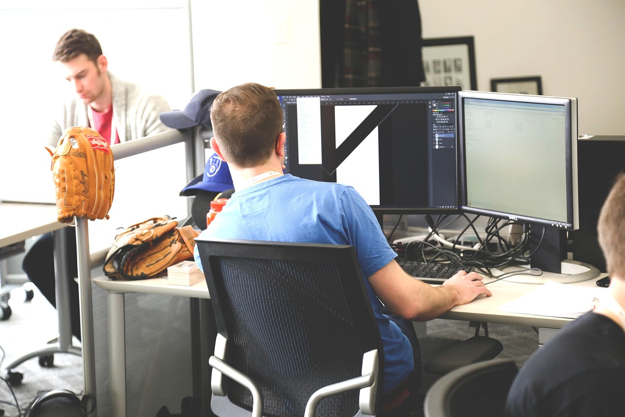 team reviewing wireframes on large monitor