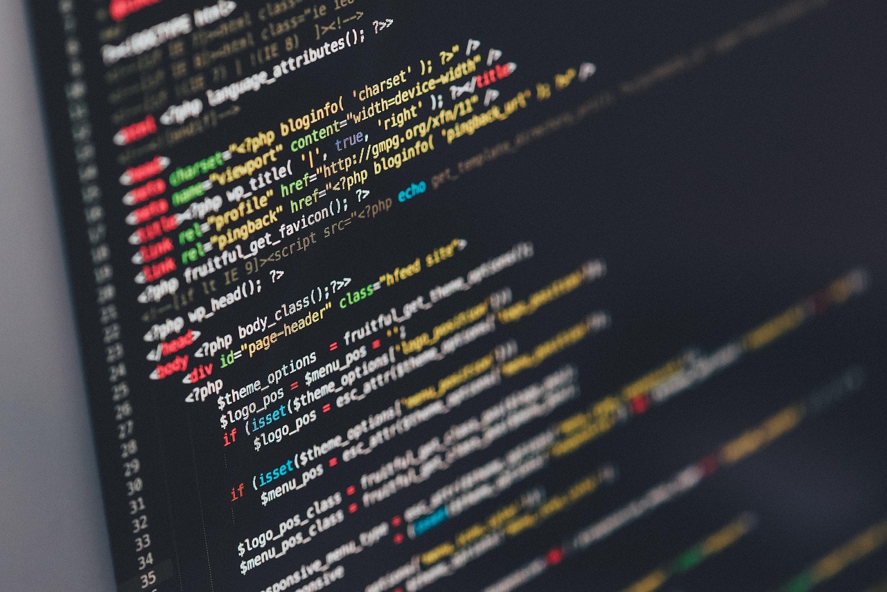 developer typing code laptop